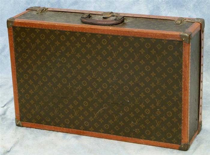 Appraisal: Louis Vuitton hard suitcase strap handle replaced interior relatively clean