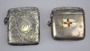 Appraisal: An Edwardian silver vesta case enamelled with a pennant from