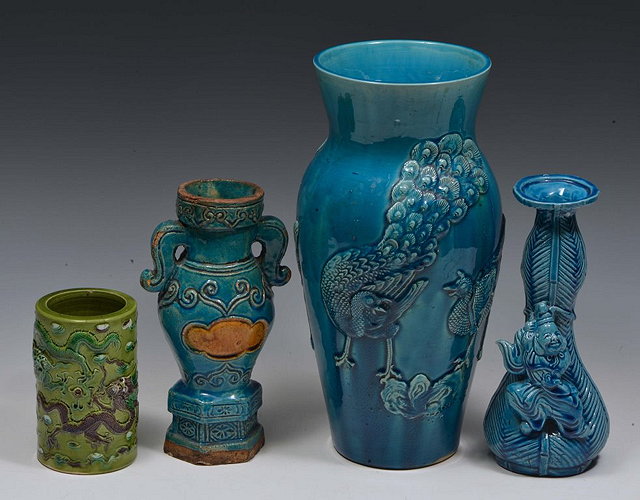 Appraisal: A JAPANESE TURQUOISE GLAZED TAPERING VASE with peacock raised decoration