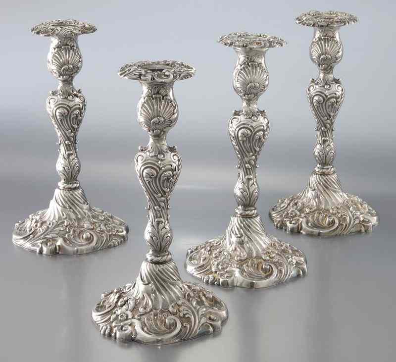 Appraisal: Tiffany and Co silver plate candlesticksdecorated with repousse scrolls and