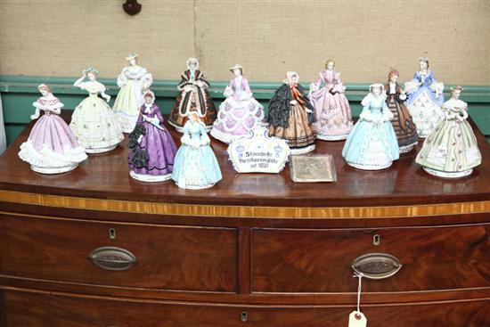 Appraisal: FIFTEEN PIECES RELATED TO GODEY'S LADY'S BOOKS Thirteen figurines representing