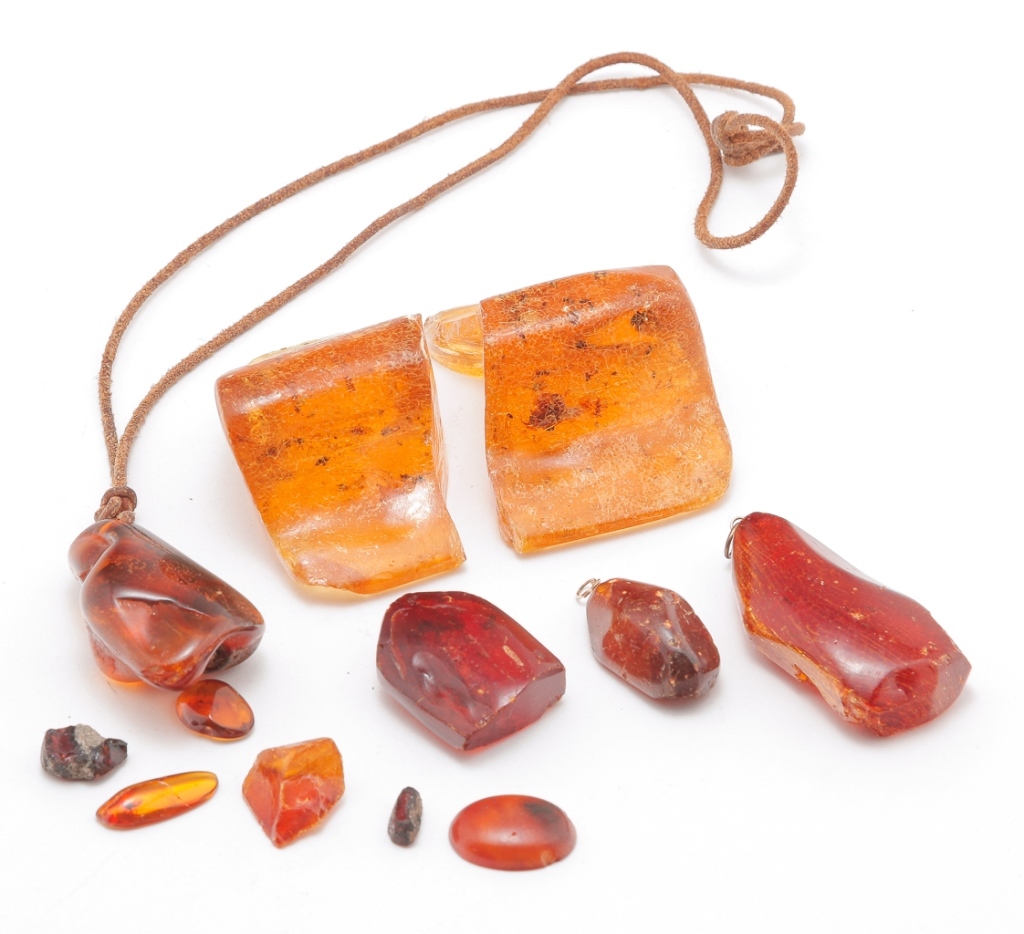 Appraisal: Group of rough and polished amber pieces including one large