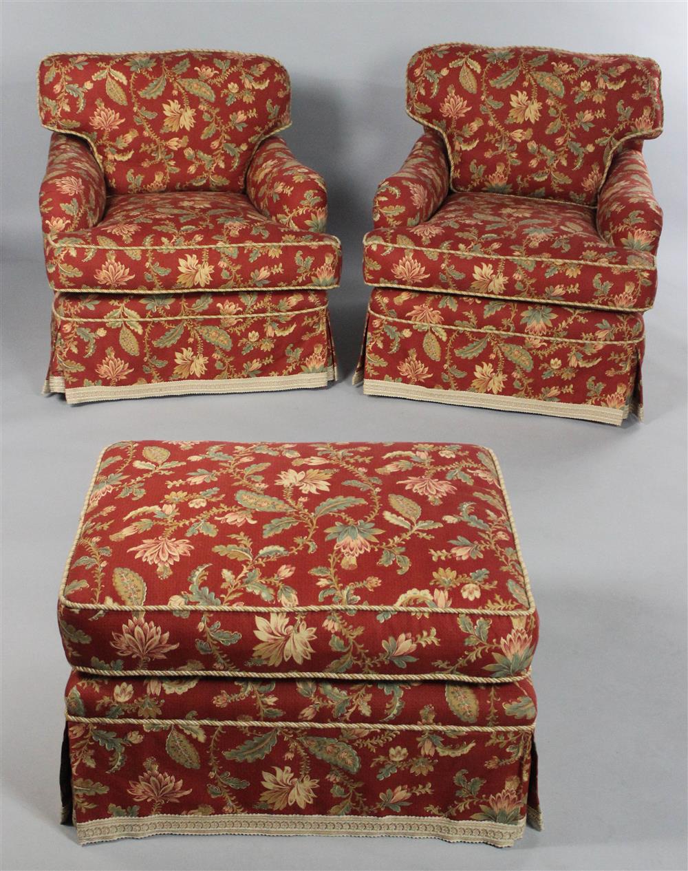 Appraisal: PAIR OF OVERUPHOLSTERED CLUB CHAIRS AND OTTOMAN with loose cushioned