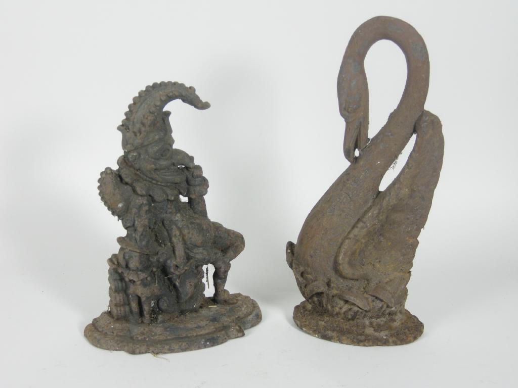 Appraisal: A cast iron Mr Punch Doorstop Hearth Ornament and Swan