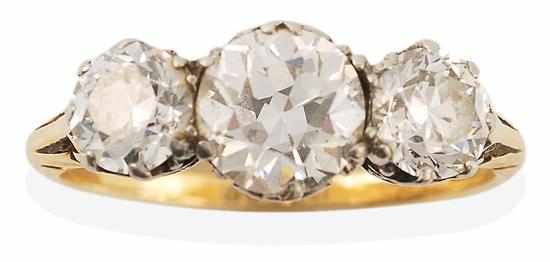 Appraisal: AN ANTIQUE THREE STONE DIAMOND RING Centrally set with an