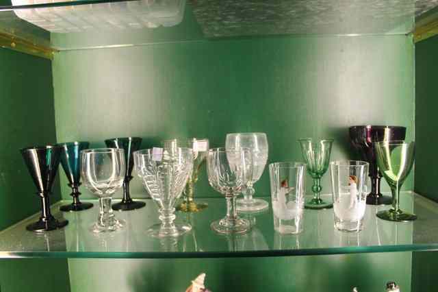 Appraisal: THREE ANTIQUE BRISTOL GREEN WINE FLUTES and a small collection