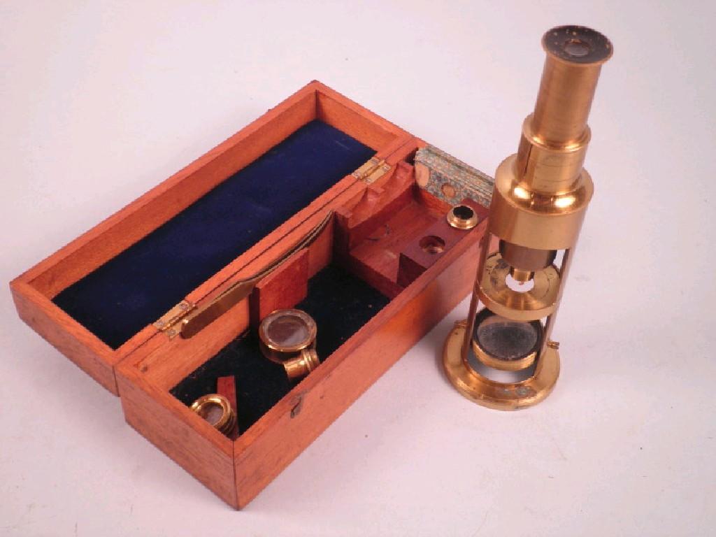 Appraisal: A late thC brass portable microscope and six slides in