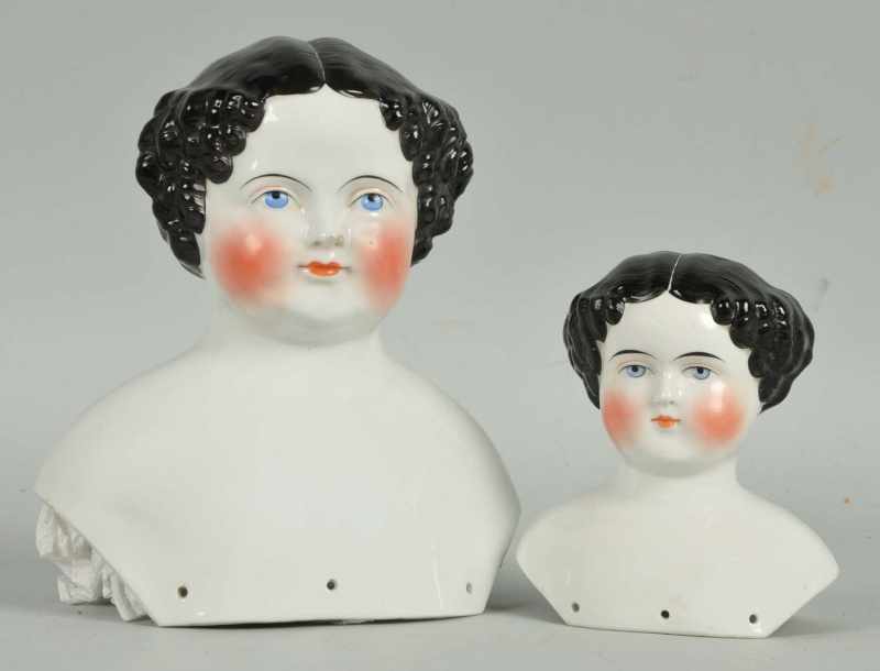 Appraisal: Lot of German China Doll Heads Description s hairdo with