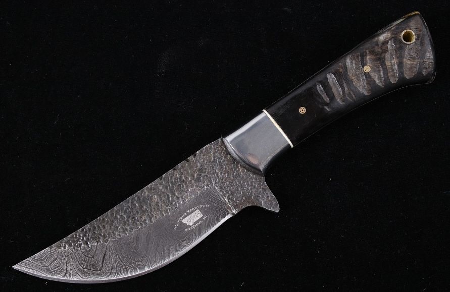 Appraisal: M T Knives Rams Horn Damascus Hammered Knife This is