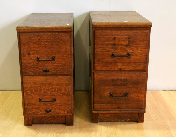 Appraisal: A matched pair of mid th century oak filing cabinets