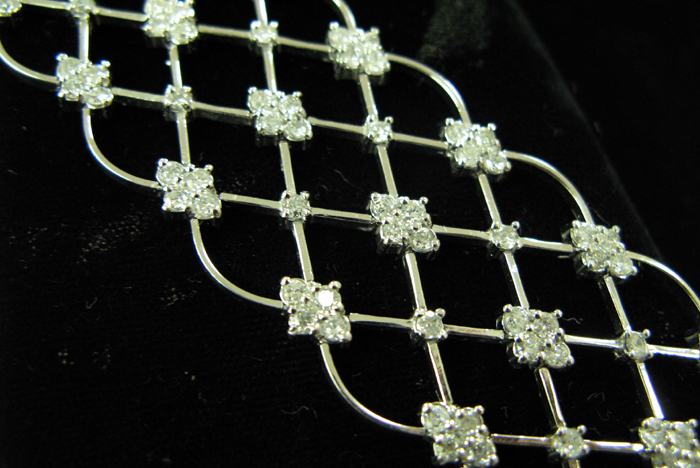 Appraisal: DIAMOND AND FOURTEEN KARAT WHITE GOLD CUFF BRACELET WITH APPRAISAL