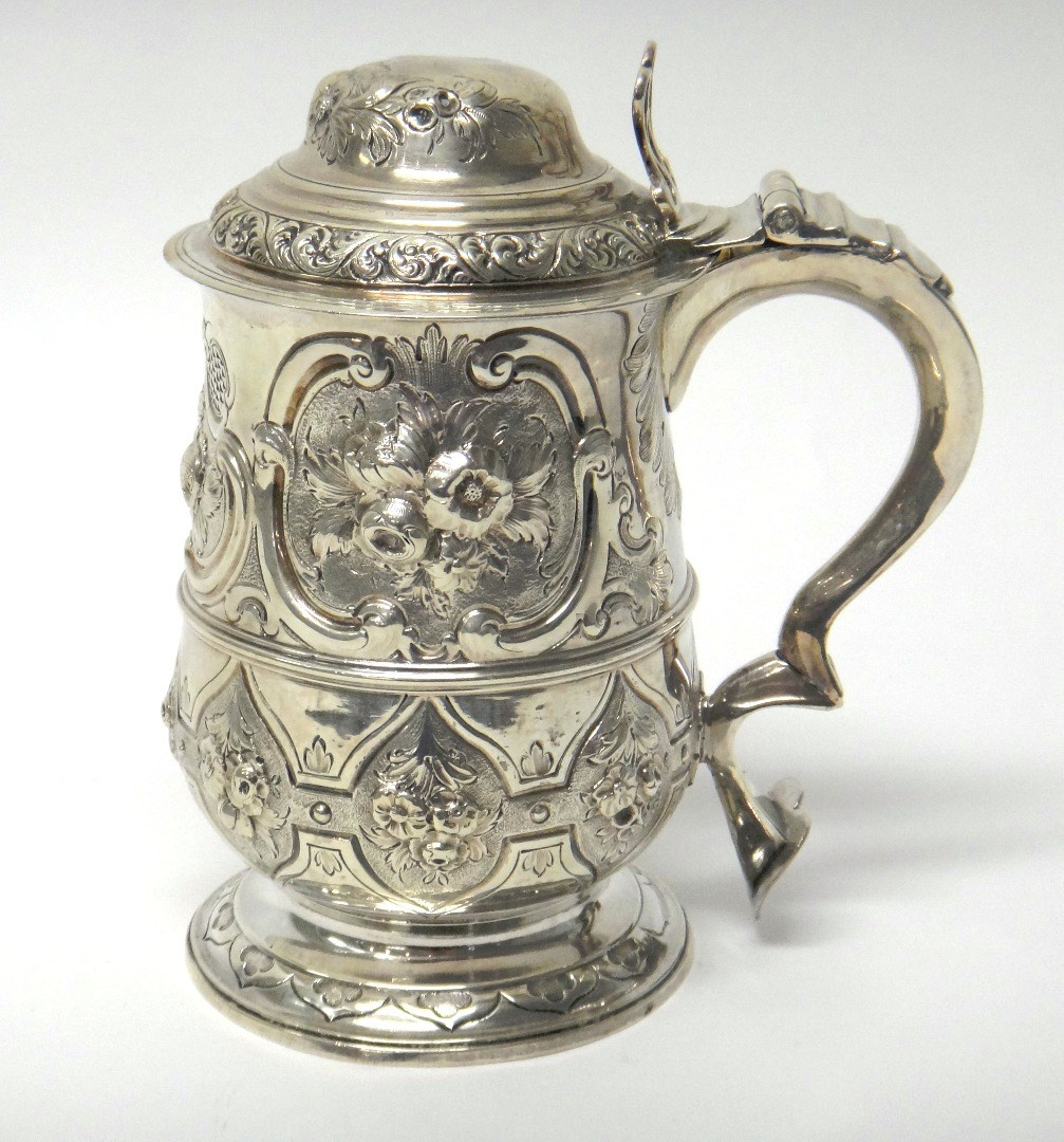 Appraisal: A George III silver tankard of baluster form with later