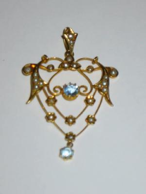 Appraisal: AN EDWARDIAN AQUAMARINE AND SEED PEARL PENDANT the ct gold