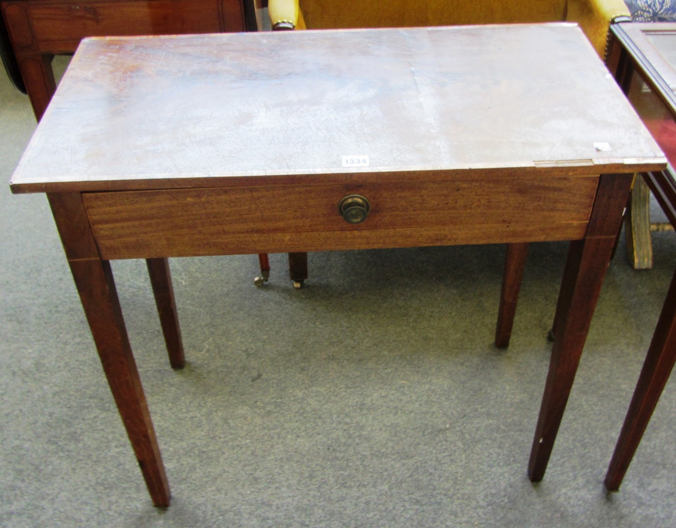 Appraisal: A George III mahogany single drawer side table on tapering