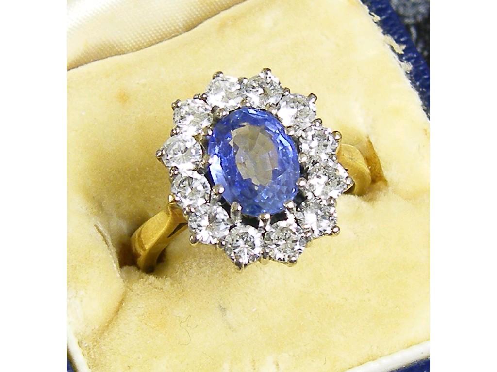 Appraisal: Good ct sapphire and diamond oval cluster ring with a