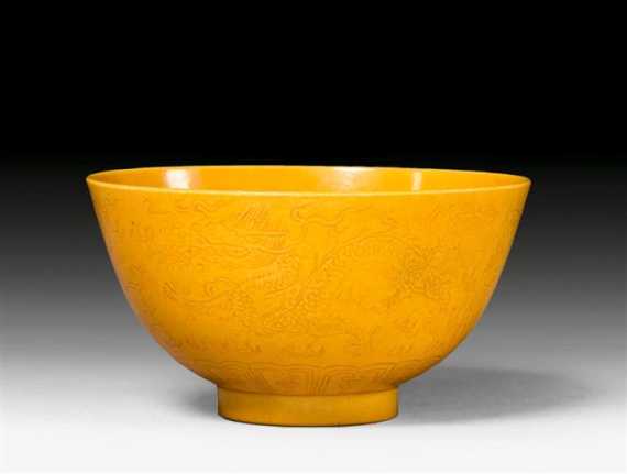 Appraisal: A YELLOW BOWL WITH INCISED DRAGON AND PHOENIX DESIGN China