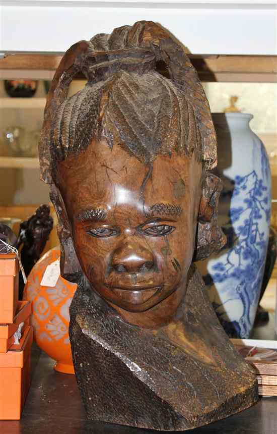 Appraisal: An African carved hardwood bust of a negro unsigned ins