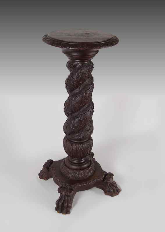 Appraisal: HEAVY VICTORIAN BLACK WALNUT CARVED PEDESTAL Turned top supported by