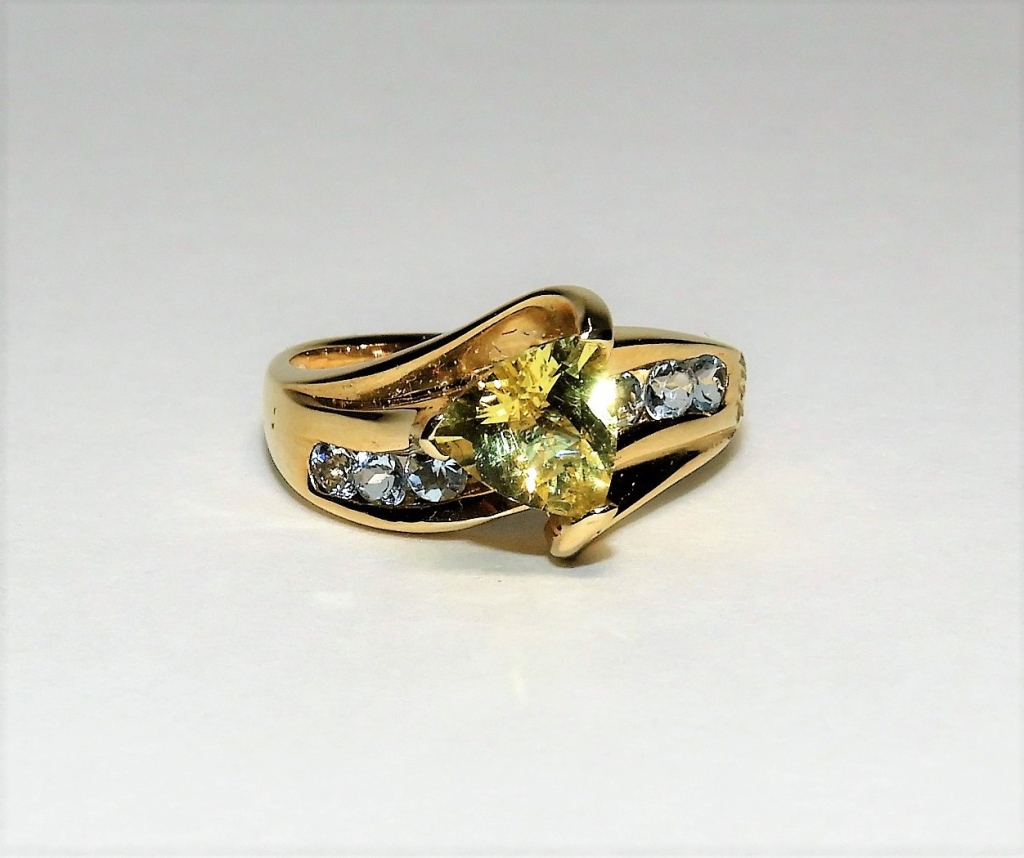 Appraisal: K YELLOW GOLD CITRINE ZIRCONIA COCKTAIL RING ContemporaryTriangular cut citrine