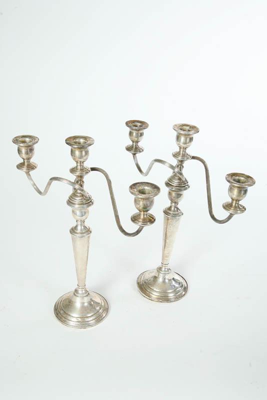 Appraisal: TWO MATCHING STERLING SILVER CANDELABRAS On circular bases with baluster