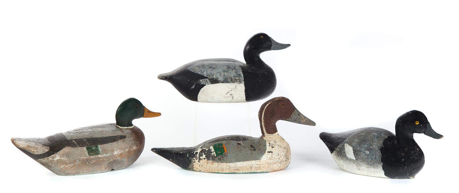 Appraisal: FOUR AMERICAN DUCK DECOYS Mid th century Wooden working decoys