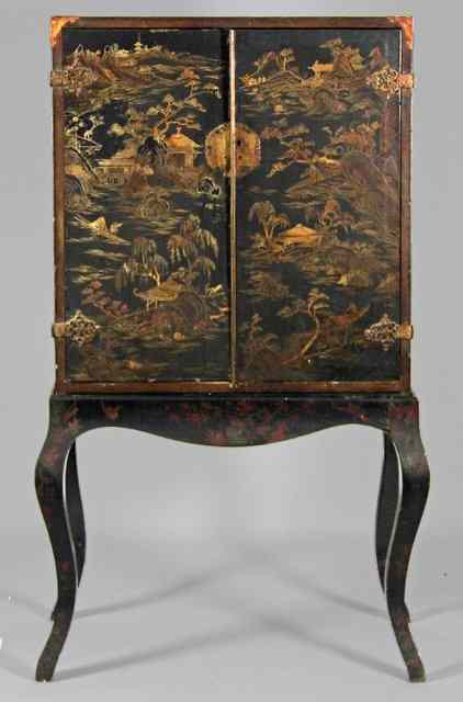 Appraisal: A Chinese lacquer cabinet on English stand the cabinet decorated