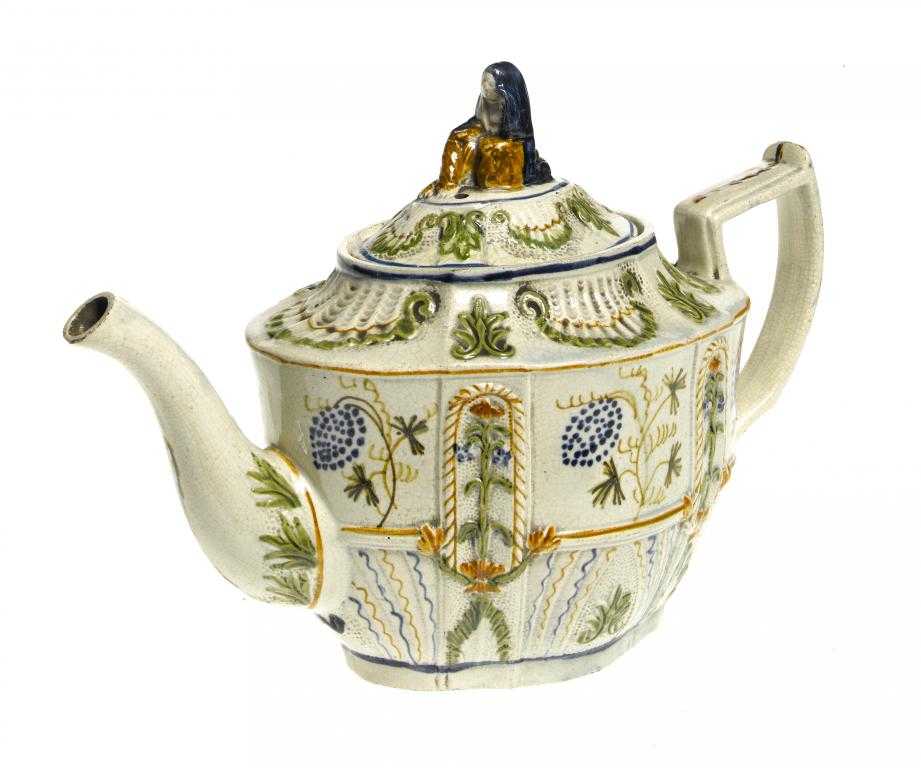 Appraisal: A PEARLWARE TEAPOT AND COVER of finely modelled oval shape