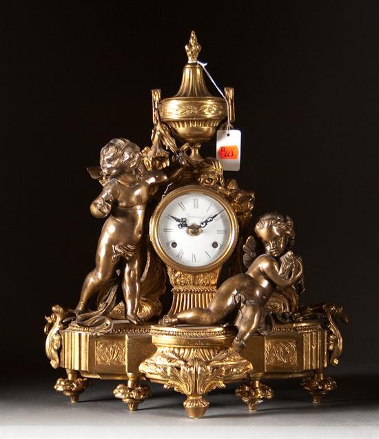 Appraisal: Louis XVI style gilt-metal and brass figural mantel clock th