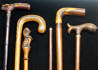 Appraisal: Group of five walking sticks with animal figure handles th