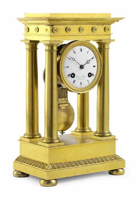 Appraisal: A French th century gilt brass four pillar mantel clock