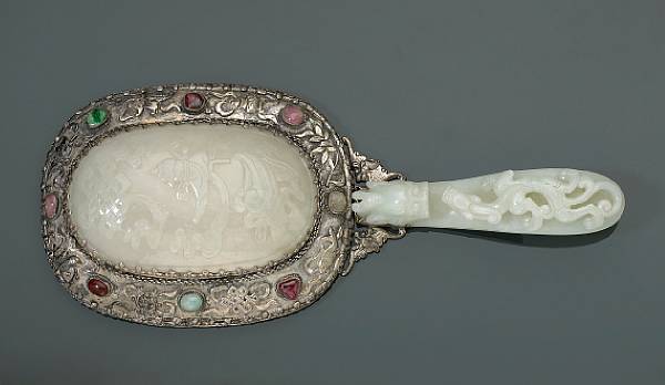 Appraisal: A silvered metal hand mirror with jade mounts The mirror