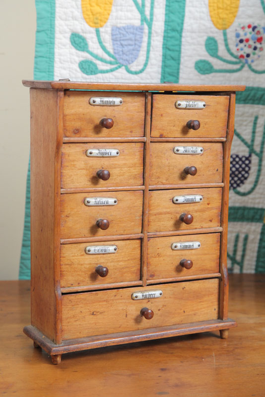 Appraisal: GERMAN SPICE BOX Nine drawers with porcelain labels and small