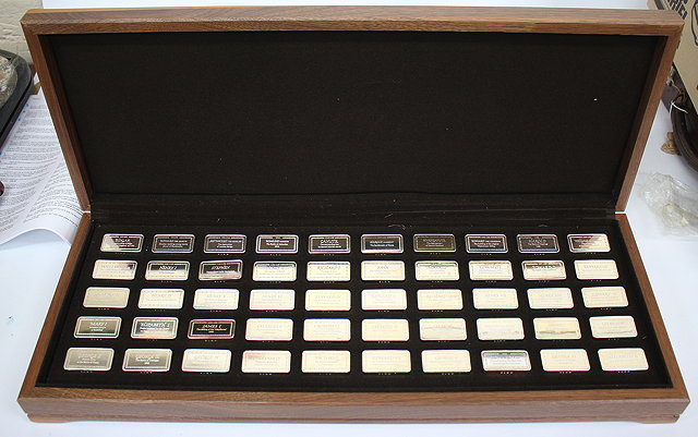 Appraisal: A CASED SET OF FIFTY STERLING SILVER INGOTS commemorating one