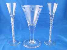 Appraisal: A hand blown wine glass with folded foot engraved to