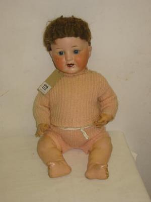 Appraisal: An Armand Marseille bisque head character doll with blue sleeping