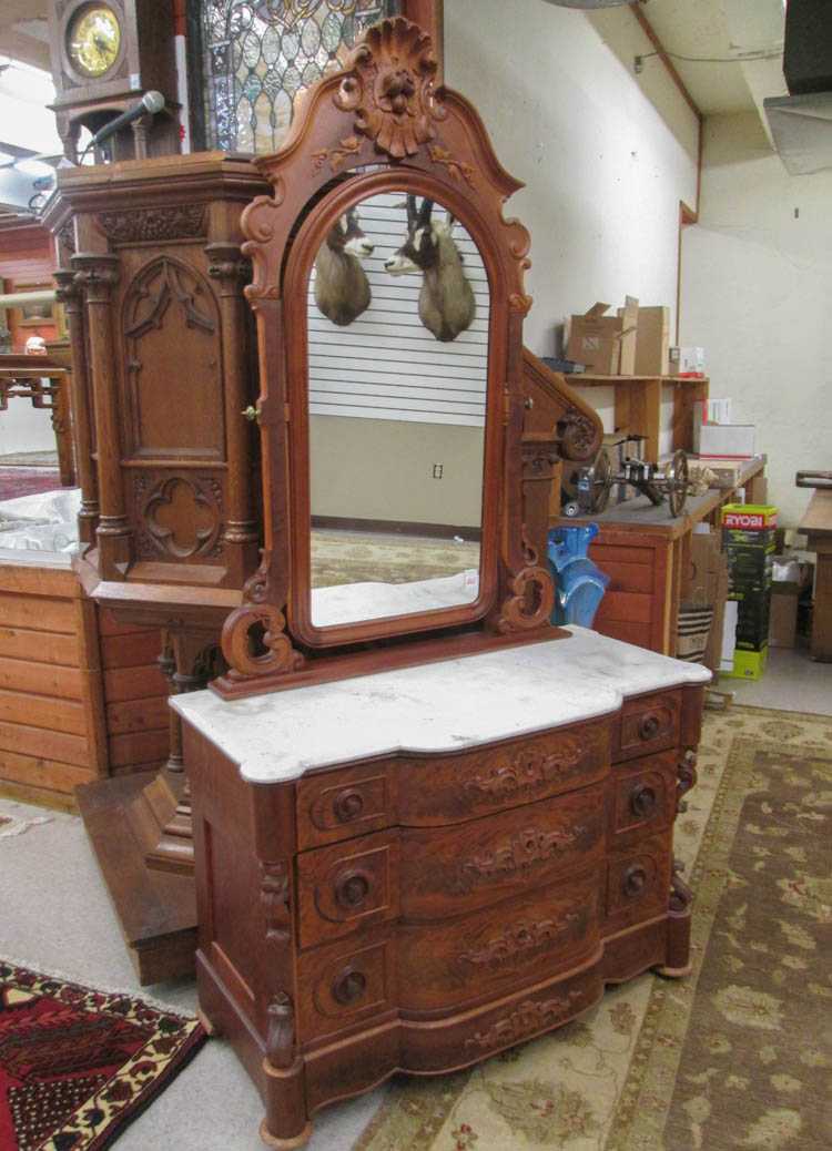 Appraisal: A VICTORIAN MARBLE-TOP WALNUT DRESSER WITH MIRROR Renaissance Revival American