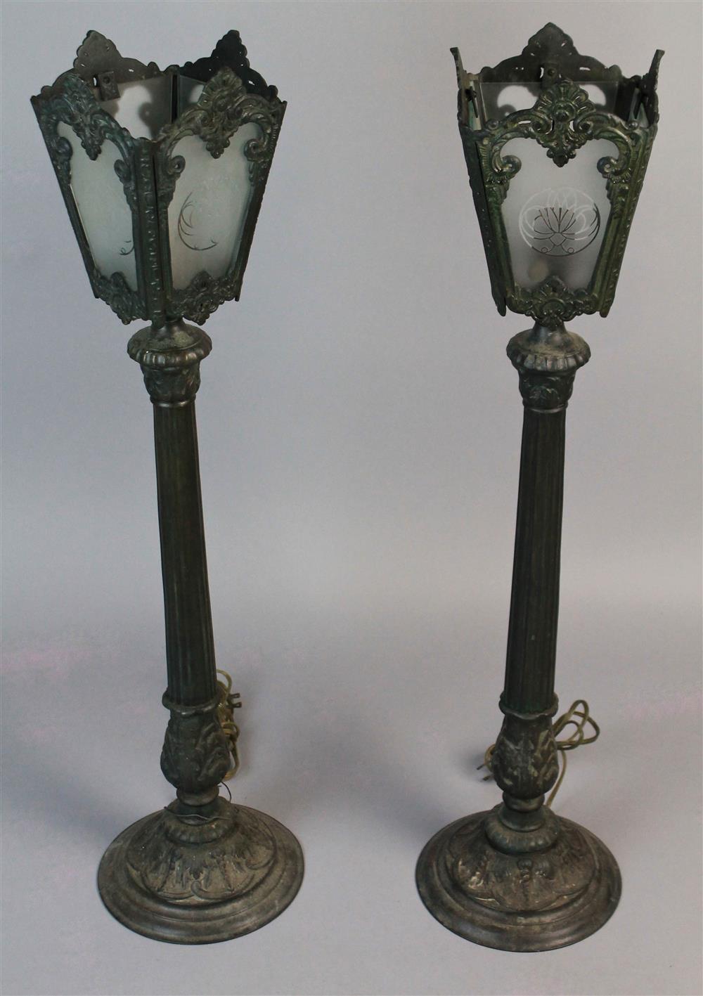 Appraisal: PAIR OF GREENISH-BLACK METAL TALL COLUMNAR TABLE LAMPS ELECTRIFIED having