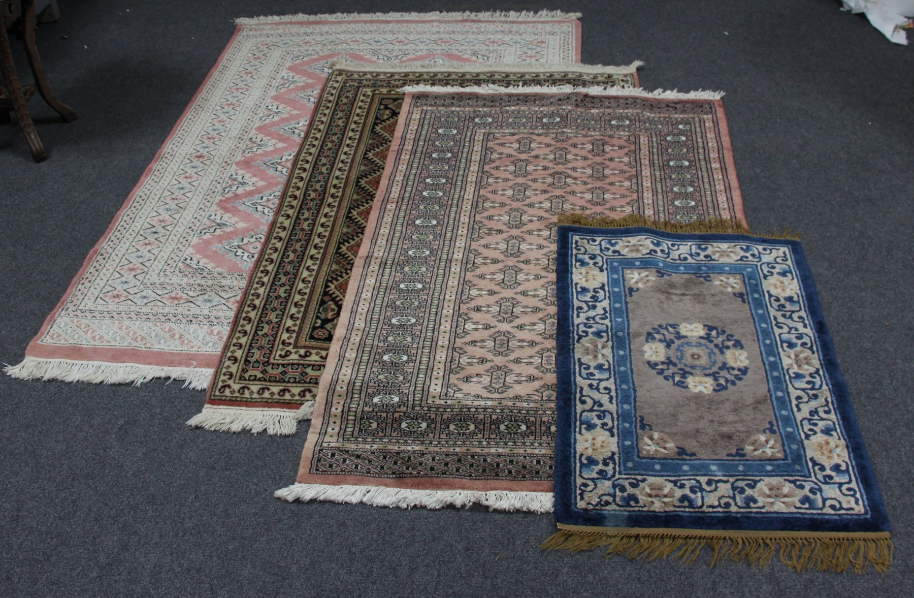 Appraisal: A modern Bokhara rug cm x cm ''x '' and