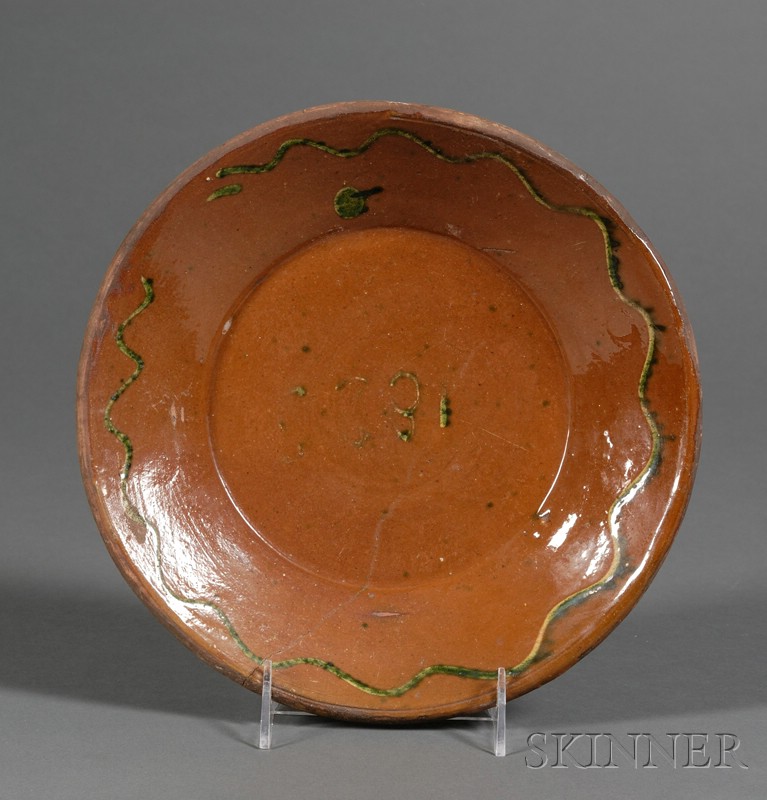 Appraisal: Redware Plate America early th century round plate with green