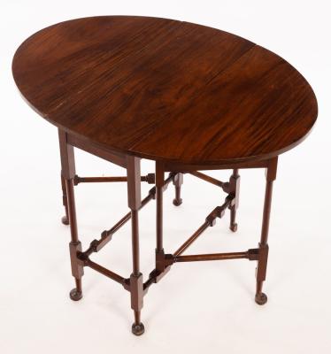 Appraisal: An oval two-flap table on turned legs with pad feet