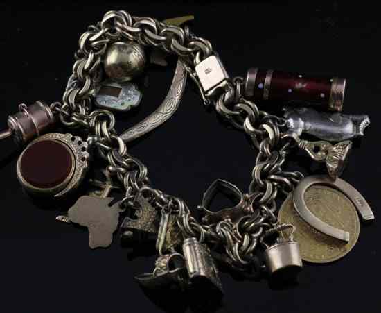 Appraisal: A ct gold multi-link charm bracelet hung with nineteen assorted