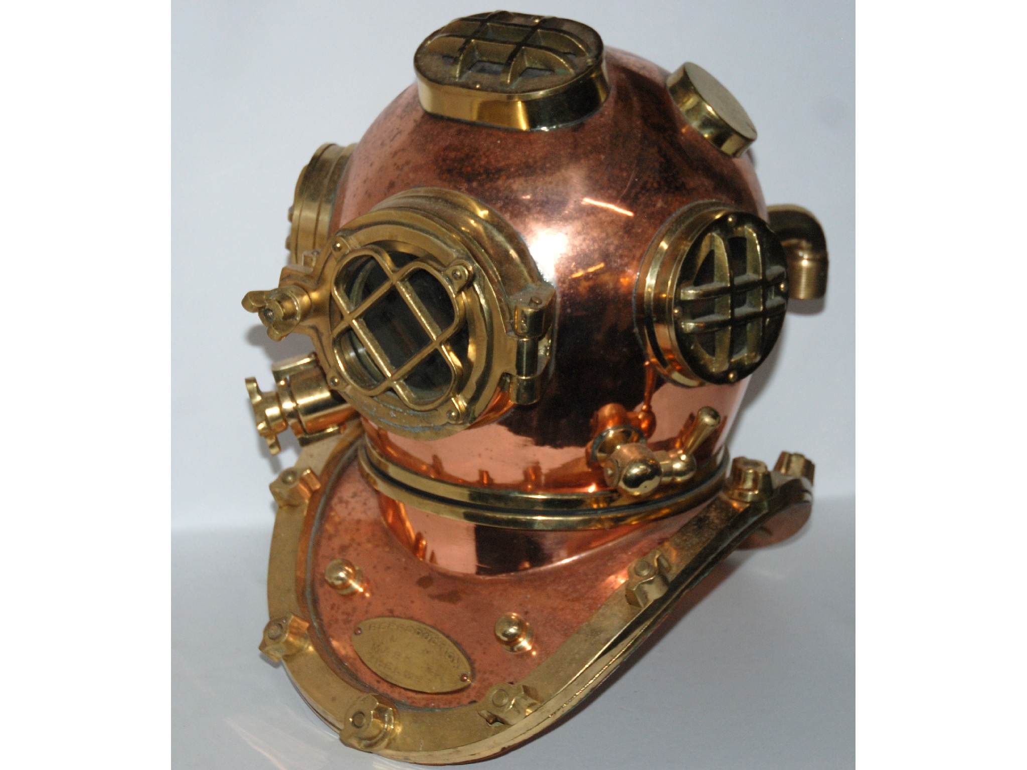 Appraisal: A reproduction brass and cooper divers helmet