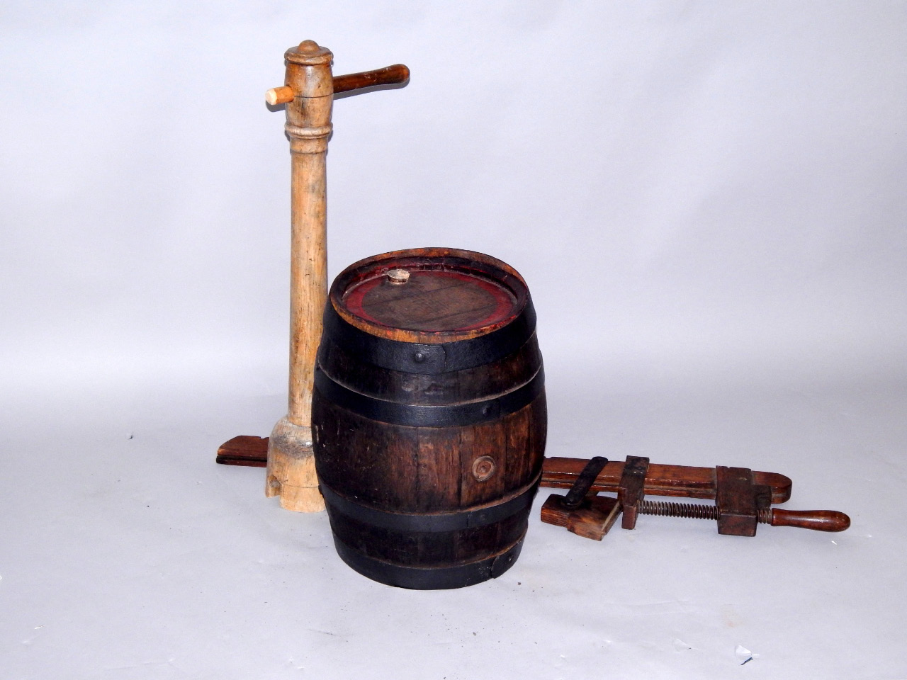 Appraisal: An oak and iron bound barrel cm high oak brace