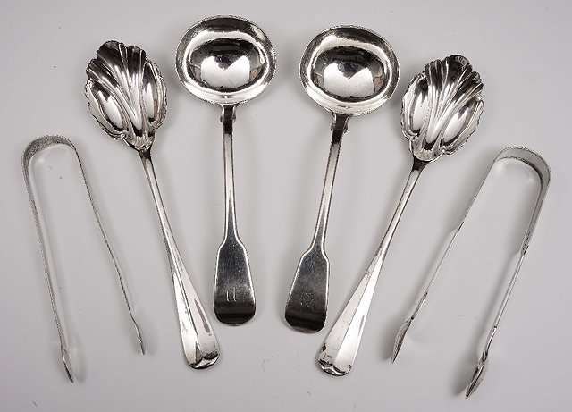 Appraisal: A pair of fiddle pattern silver sauce ladles monogrammed London