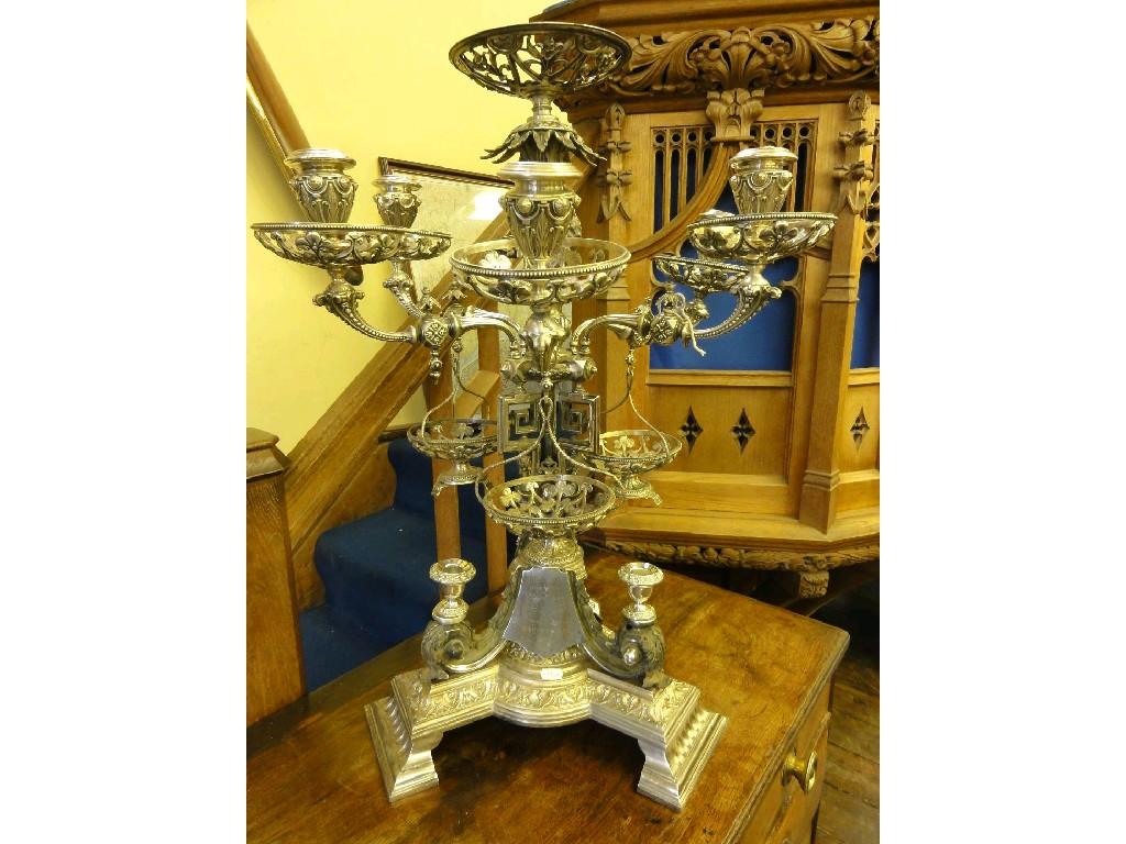 Appraisal: A large silver plated epergne table centre the central column