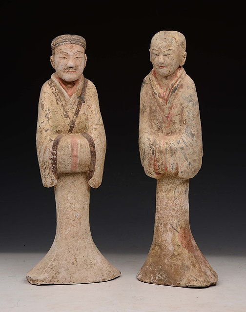 Appraisal: A PAIR OF CHINESE PAINTED POTTERY TOMB FIGURES male and