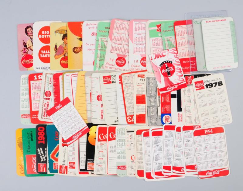 Appraisal: Large Lot Of Coca - Cola Pocket Calendars This group