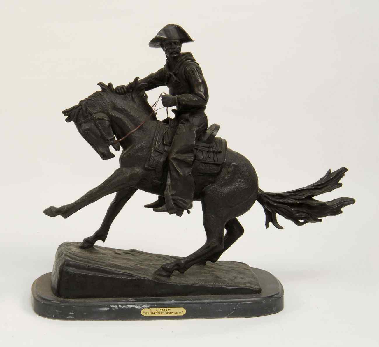 Appraisal: BRONZE SCULPTURE COWBOY''After Frederic Remington Marble base Height '' ''