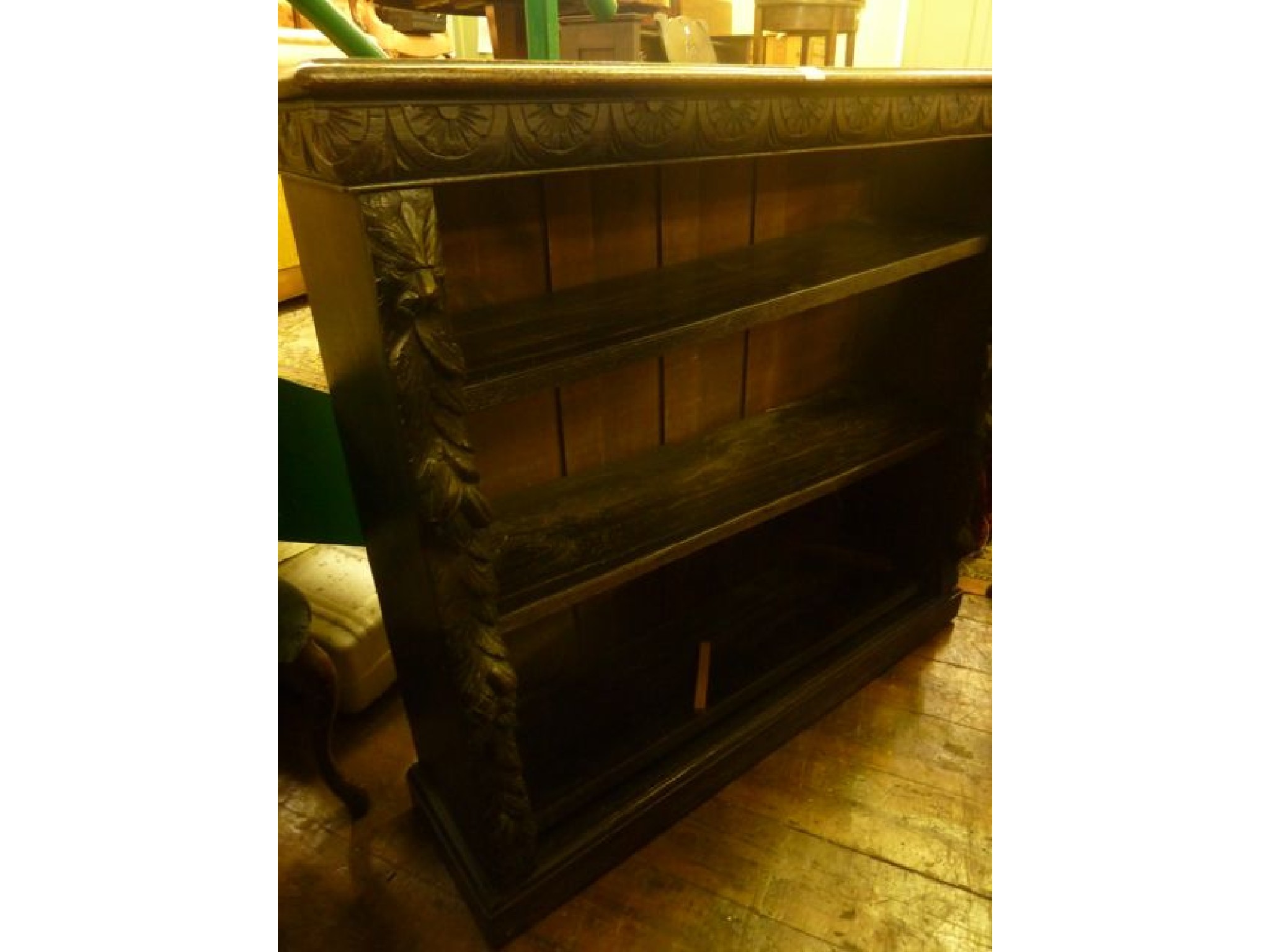 Appraisal: A Victorian dark stained oak freestanding open bookcase with three