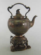 Appraisal: A large Victorian silver tea kettle on stand with burner